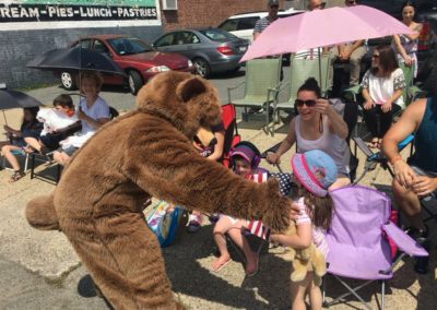 walking parade with bear
