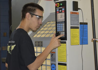 Machine Technology student working with machine
