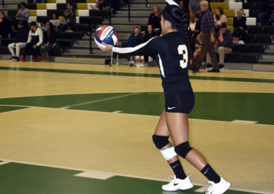Serving at girls volleyball game