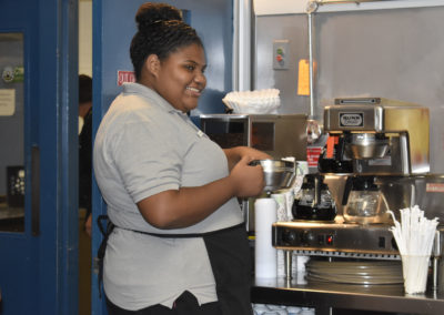 culinary student making coffee