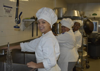 culinary student washing dishes
