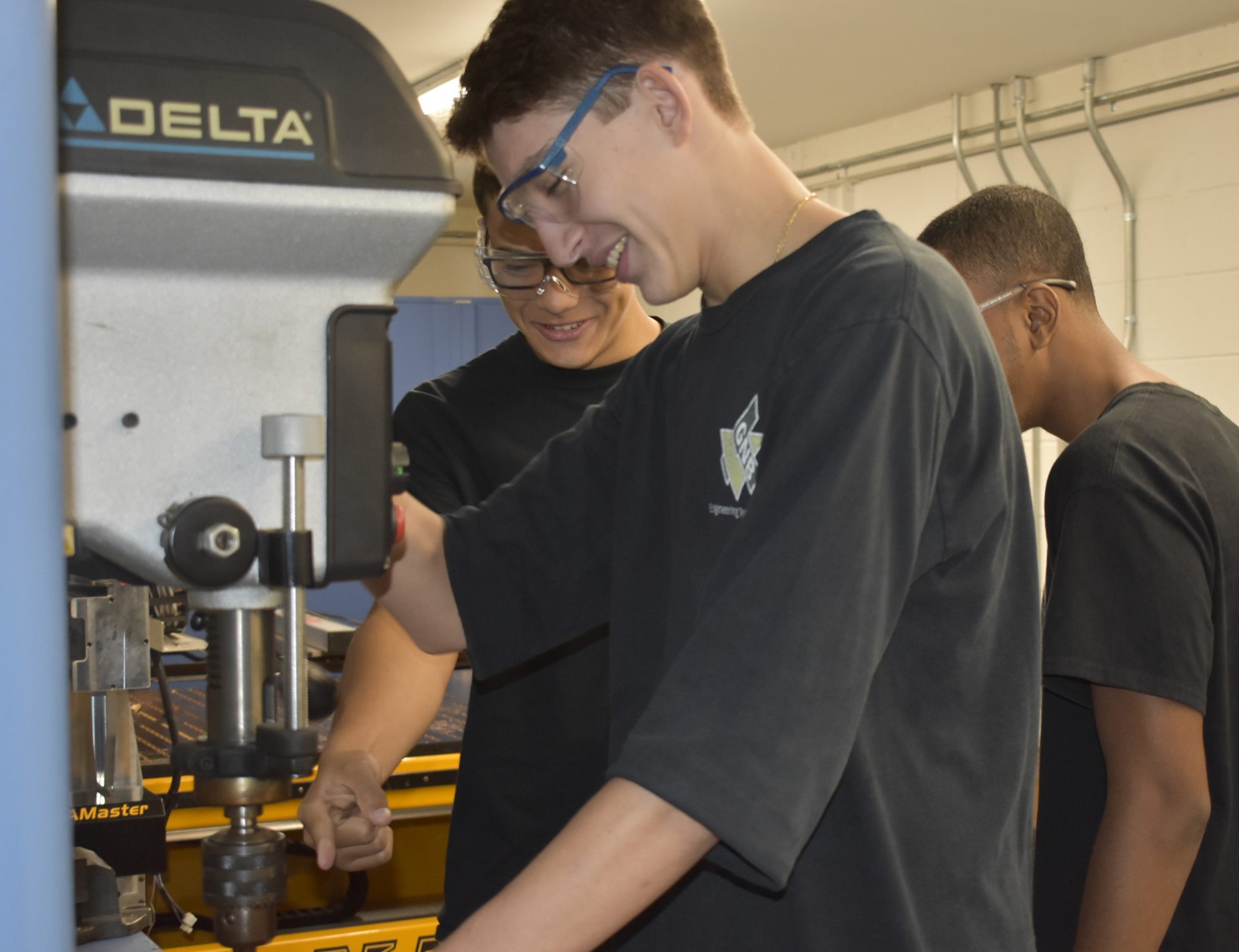 Engineering Student Working On A Delta Press