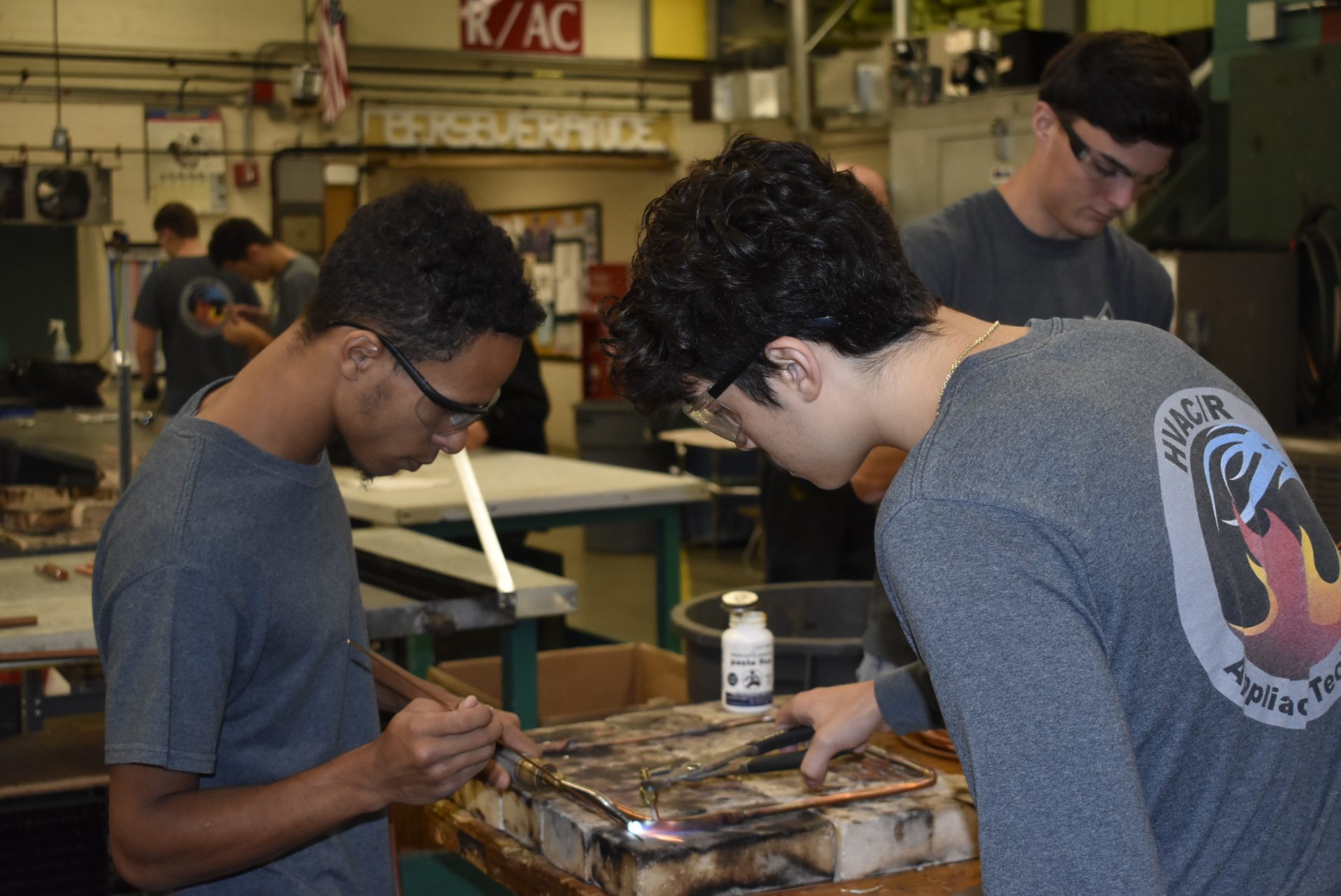 HVAC students using a blow torch