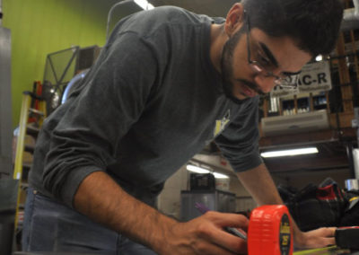 HVAC student measuring