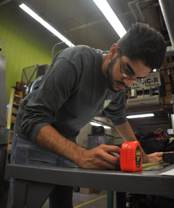 HVAC student measuring