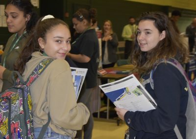 Two Shot Of Students With College Papers