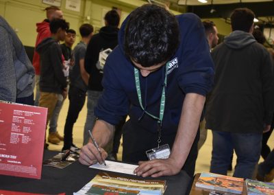 Student Signing Lincoln Tech Paper