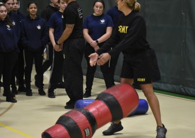 Army member rolling weights