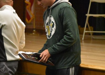 Athletic Student Looks at the award