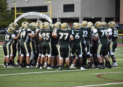 players in a group huddle
