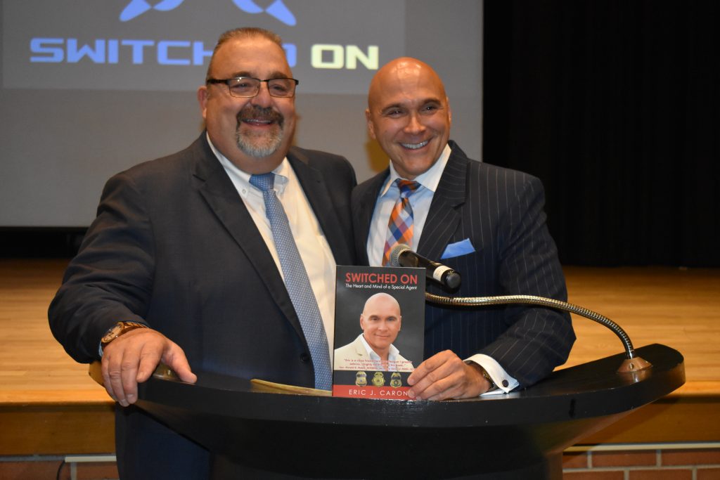 posing with book with mr. obrien laughing