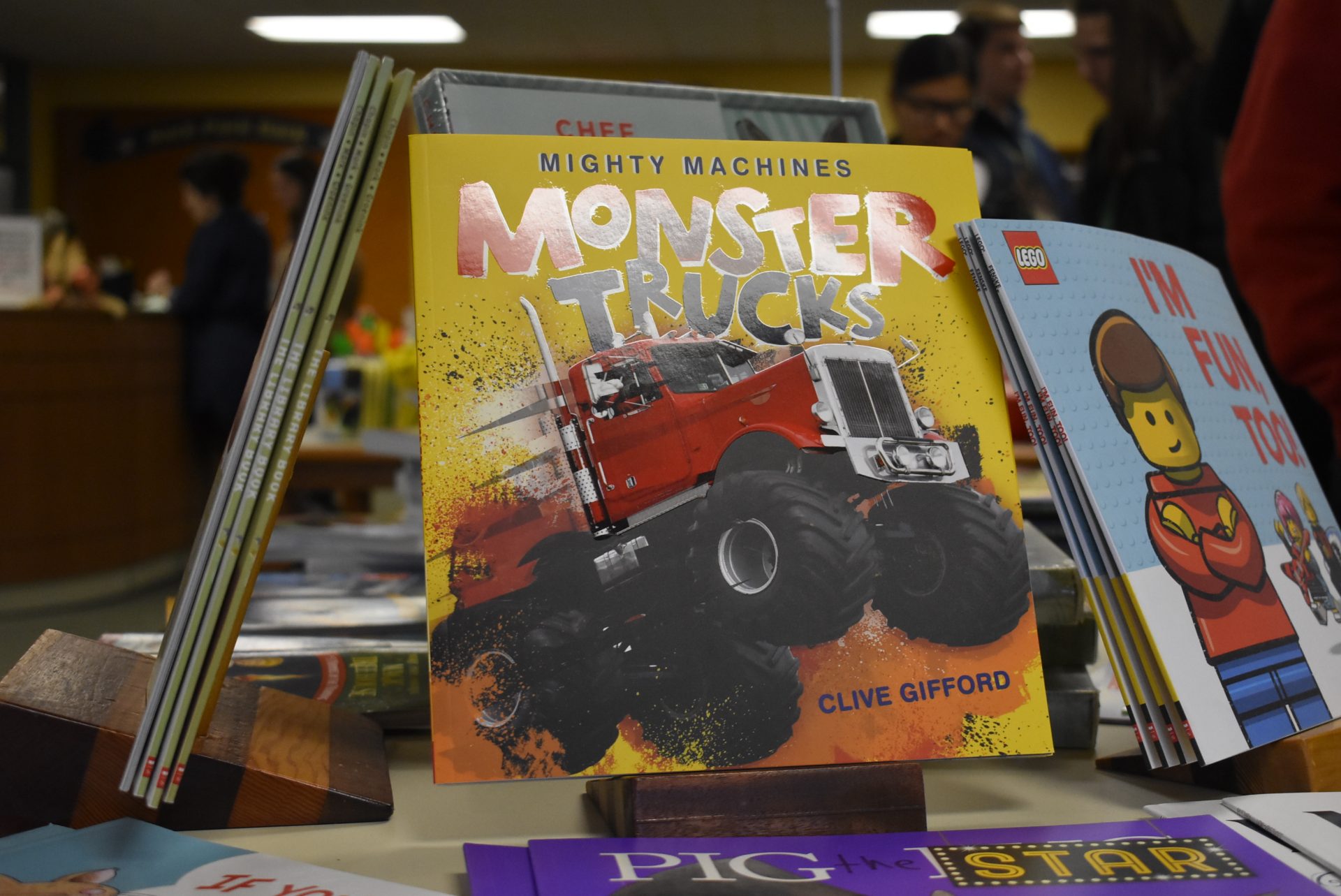 Monster Trucks Book next to Lego books