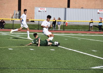 Student sliding into ball (Soccer)