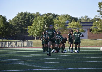 students practicing soccer