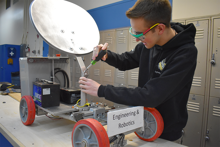 Engineering student, Andrew Sullivan, working on the satellite panel of a rover