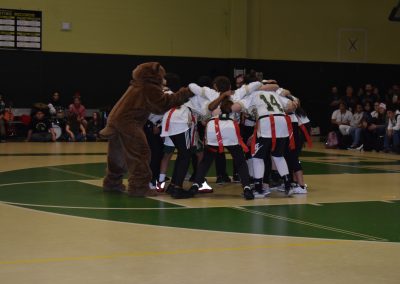 Artie the Artisan, Voc-Tech's mascot, joins in the huddle during halftime.