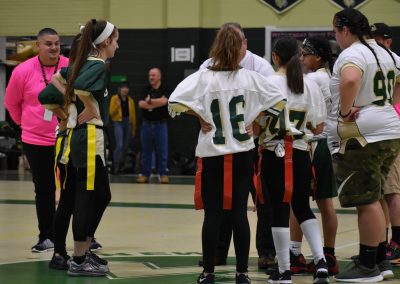 teacher discussing the rules during pep rally
