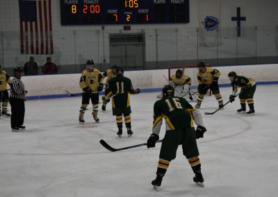voc team and opposing team on the field near voc's goal