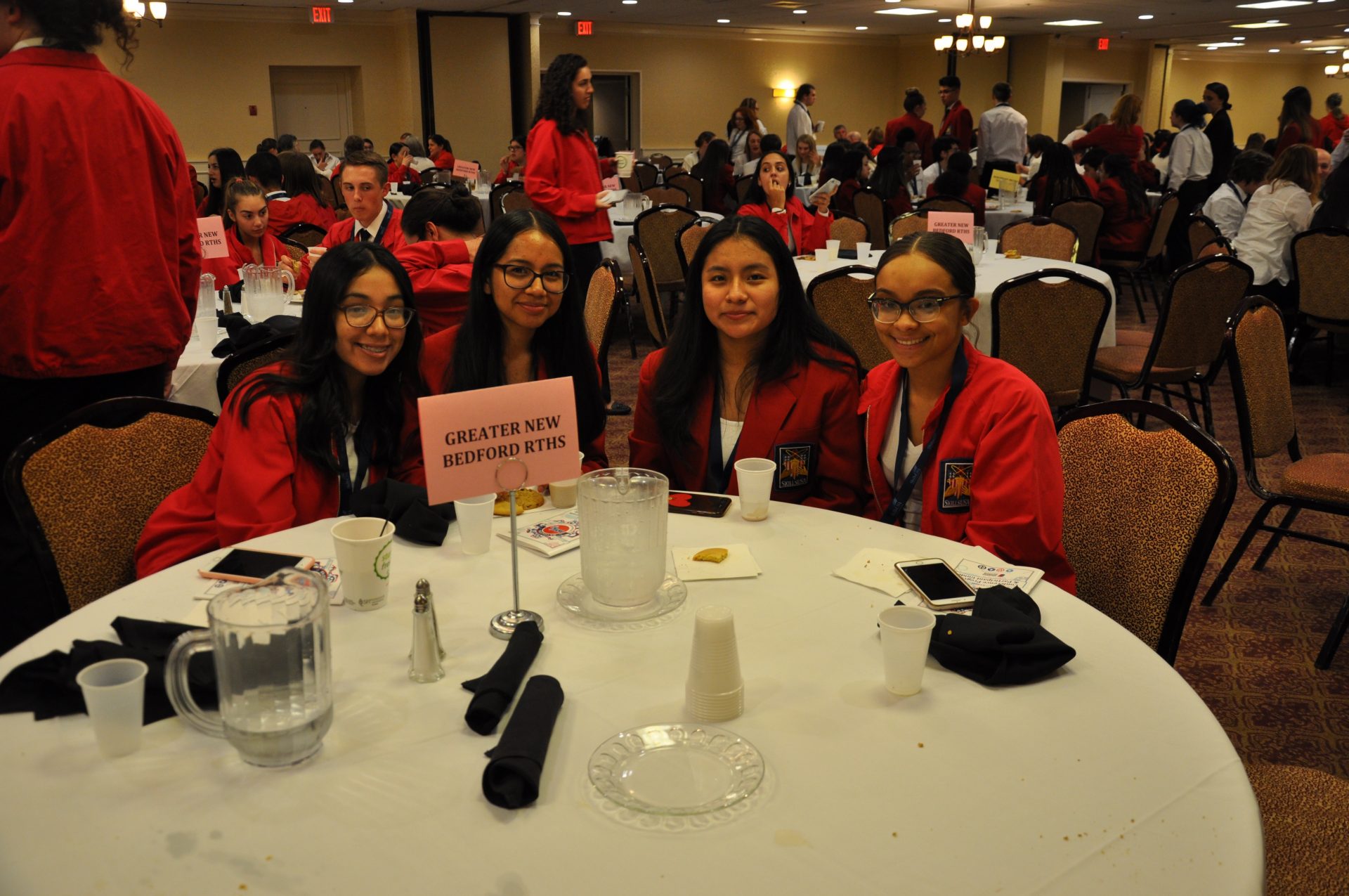 Skills USA students posing at the dinner table