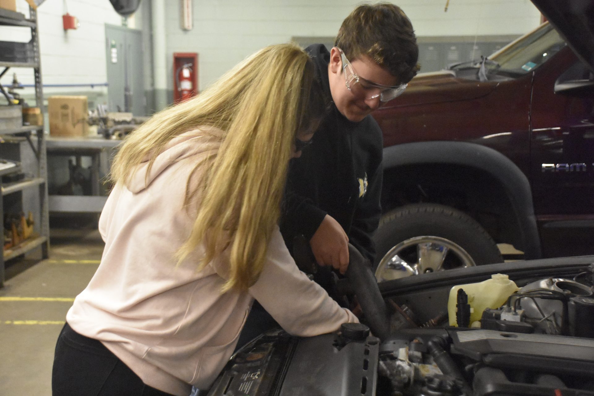 Two Students Working on Car