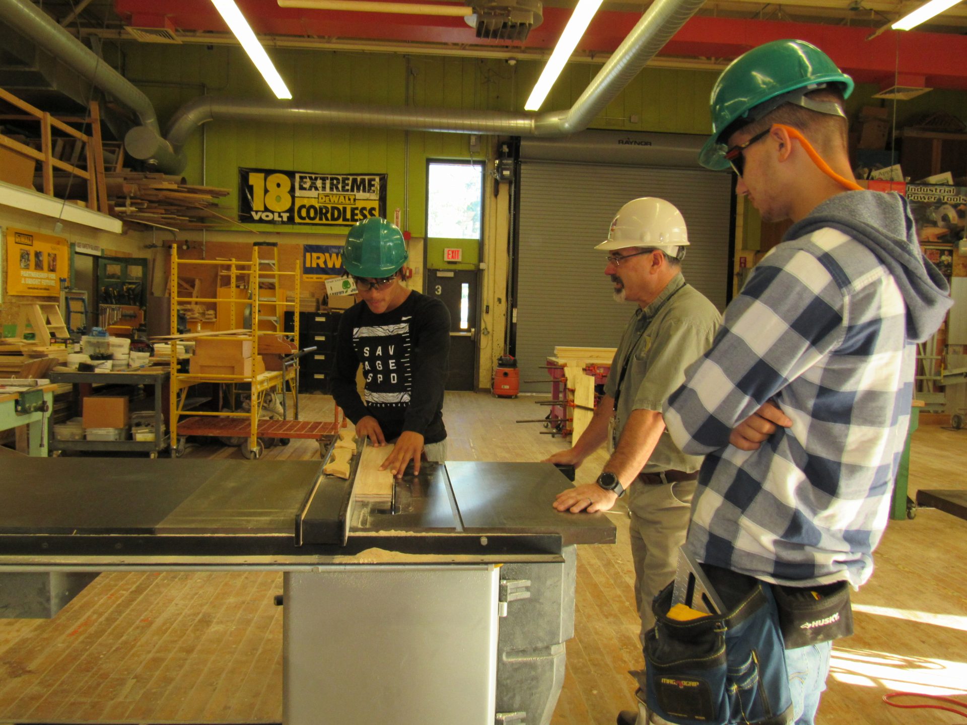 Students sawing wood
