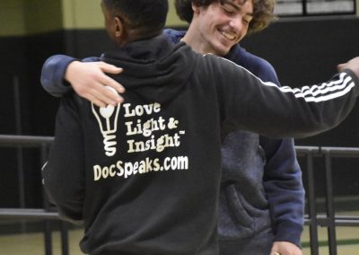 Dr Brown embracing student