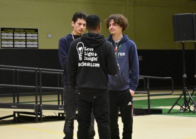 Dr Brown talking directly to two students, love, light and insight