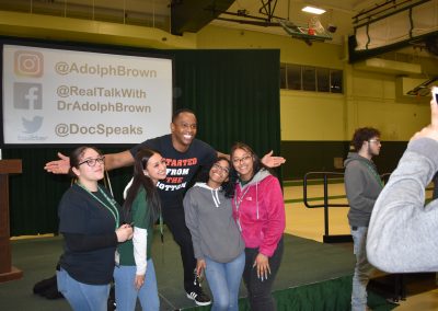 Dr Brown and group of students smiling