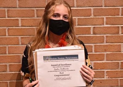 Student Taking Photo with Award 2
