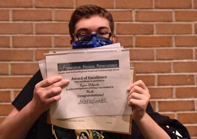Student Taking Photo with Award 3