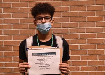 Student Taking Photo with Award 6