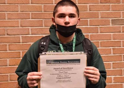 Student Taking Photo with Award 8