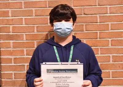 Student Taking Photo with Award 18