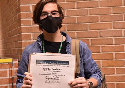 Student Taking Photo with Award 19