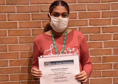 Student Taking Photo with Award 23