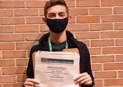 Student Taking Photo with Award 27