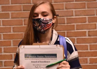 Student Taking Photo with Award 32