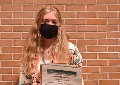 Student Taking Photo with Award 34