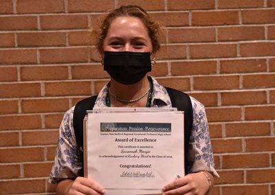 Student Taking Photo with Award 35