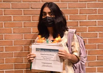 Student Taking Photo with Award 37