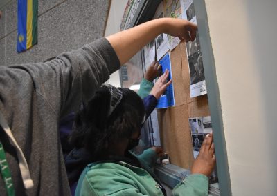 Students putting up posts in case