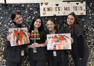 4 students at photobooth on day of kindness