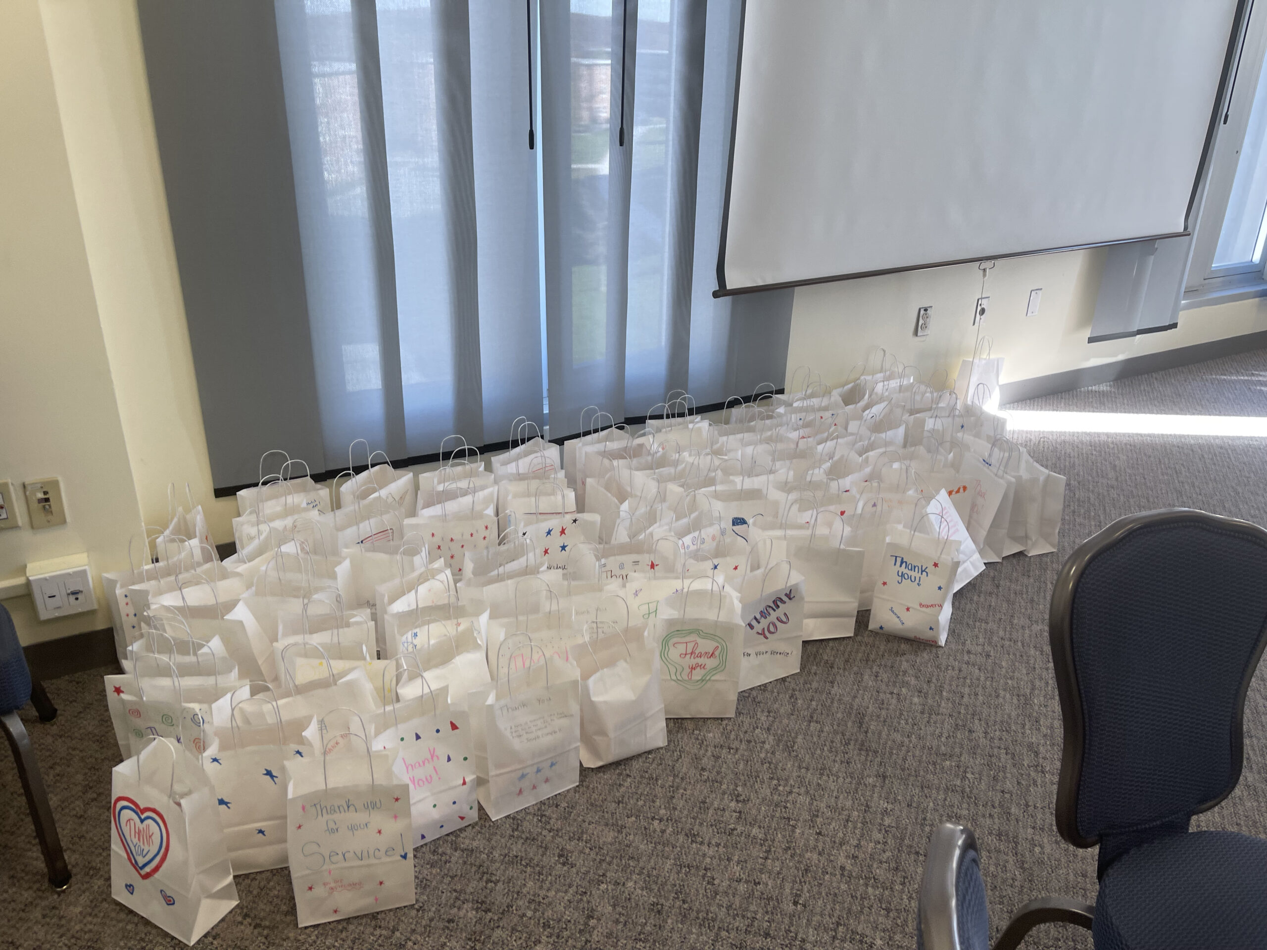 large group of goodie bags on ground