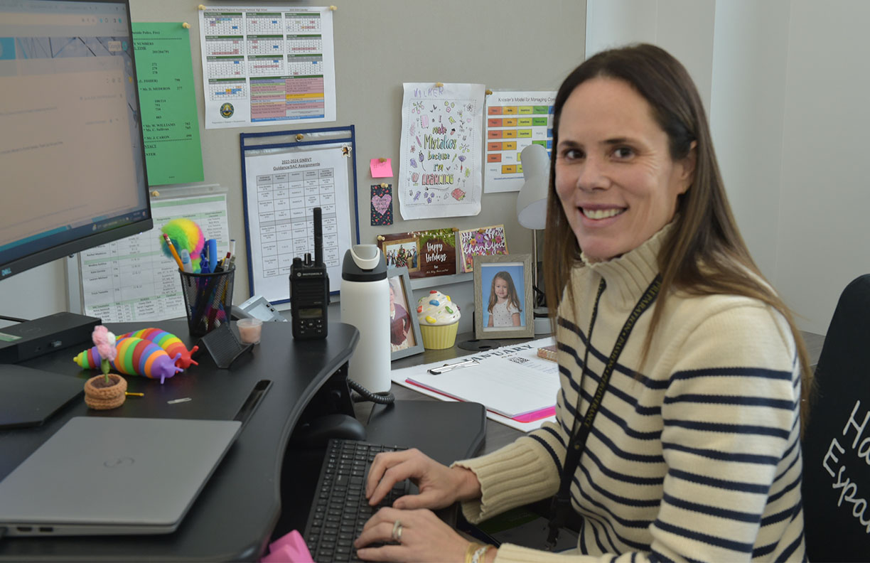 Teacher sitting and smiling