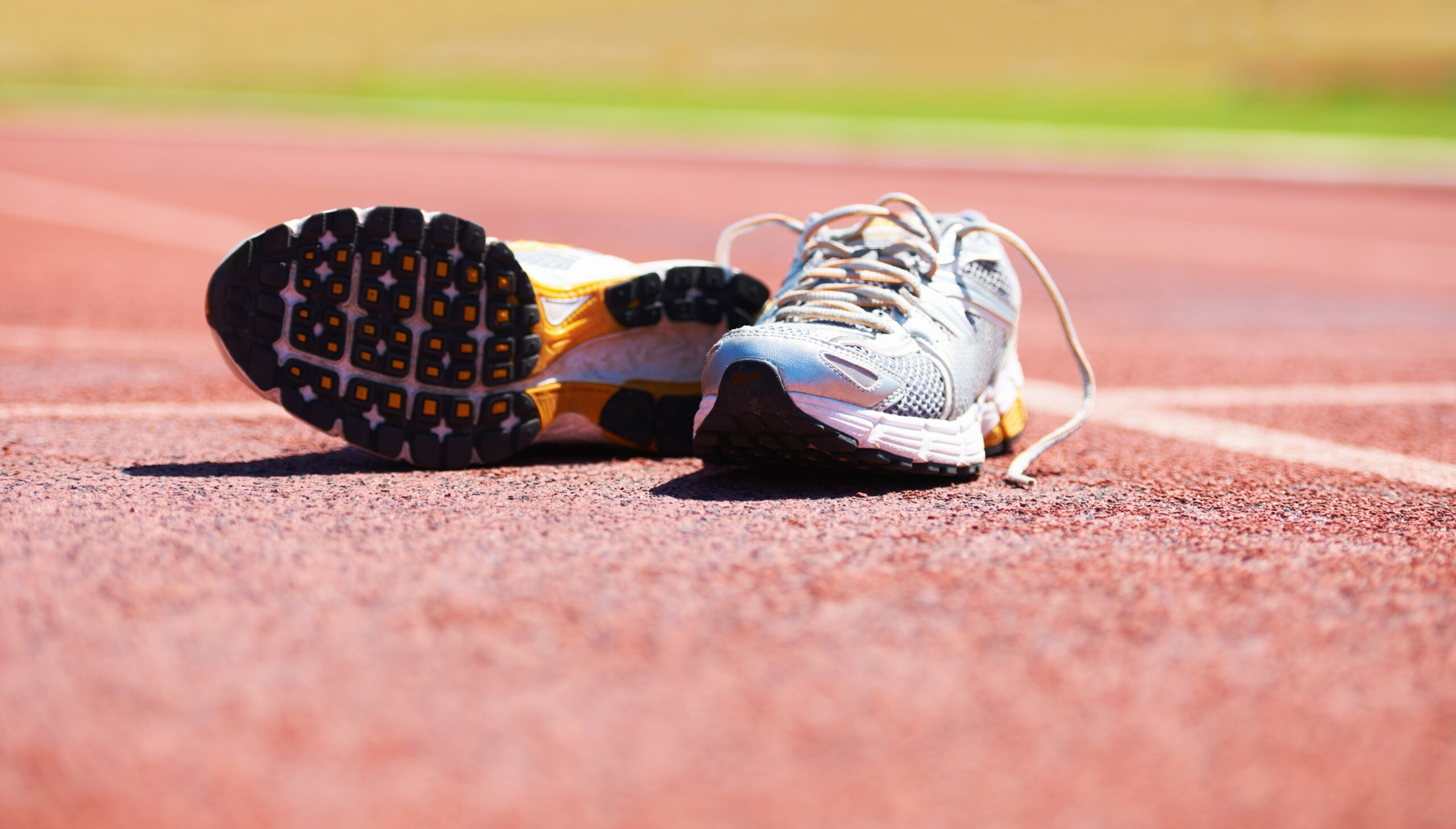 Taking a break from the race. A pair of running shoes lying on a running track
